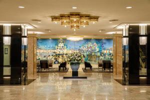a lobby with a large painting on the wall at Hotel New Otani Hakata in Fukuoka