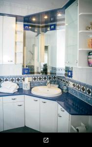 a bathroom with a sink and a large mirror at Ferienwohnung "Zum Köpfel"- Wiesenthal in der Rhön in Wiesenthal