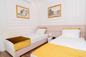 Postel nebo postele na pokoji v ubytování Eler Hotel