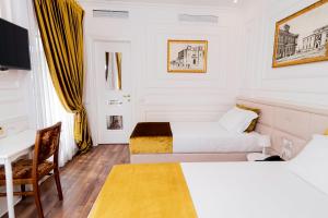 Postel nebo postele na pokoji v ubytování Eler Hotel