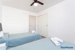Posteľ alebo postele v izbe v ubytovaní Acapulco Apartments