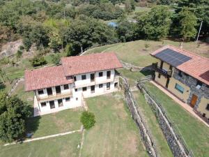 an aerial view of a house with solar panels on it at Residenza di Campagna in Chiaverano