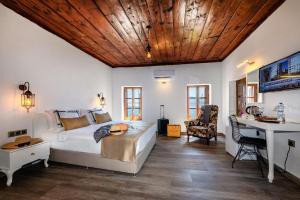 a bedroom with a bed and a desk in it at Mets Boutique Hotel in Marmaris