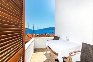 a dining room with a table and a view of the ocean at Mets Boutique Hotel in Marmaris