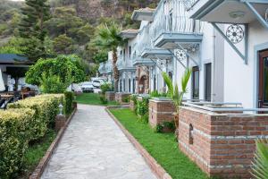 a walkway in front of a house at Majestic Hotel in Oludeniz