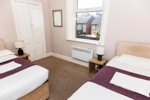 Katil atau katil-katil dalam bilik di Tyne Apartments