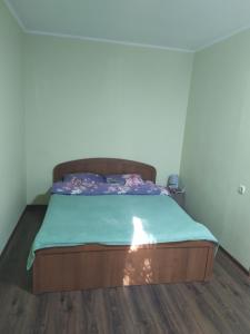 Кровать или кровати в номере Apartment Observatornyi