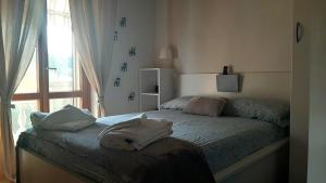 A bed or beds in a room at L'angolo di Betti