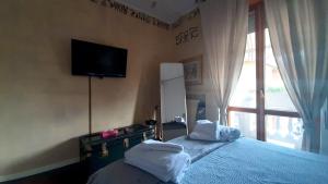 A bed or beds in a room at L'angolo di Betti