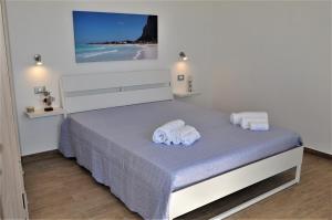 Posteľ alebo postele v izbe v ubytovaní Casa Vacanze Monte Cofano