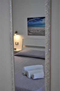 Posteľ alebo postele v izbe v ubytovaní Casa Vacanze Monte Cofano