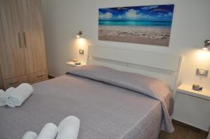 Posteľ alebo postele v izbe v ubytovaní Casa Vacanze Monte Cofano