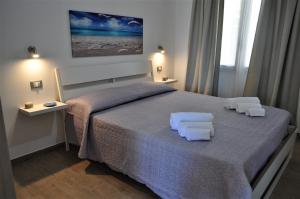 Posteľ alebo postele v izbe v ubytovaní Casa Vacanze Monte Cofano