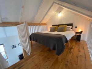 a bedroom with a bed in a attic at The Antidote in Ilfracombe