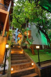 a set of stairs leading up to a building with lights at Pura Vida Hostel in Rio de Janeiro