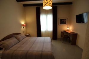 Postel nebo postele na pokoji v ubytování Villa Bulcrini