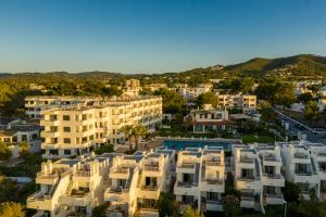 an aerial view of buildings in a city at Camelina Suites in San Antonio Bay