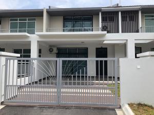 a white fence in front of a house at The Crib @ Desaru in Desaru