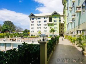 a walkway in front of a building at Centropolis King Bed Deluxe in Manila +8 photos