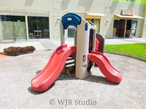 a slide with a cat laying on it at Centropolis King Bed Deluxe in Manila