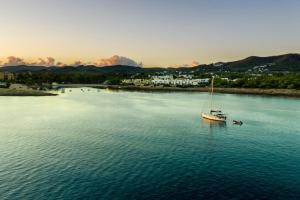 a boat in the middle of a large body of water at Camelina Suites in San Antonio Bay
