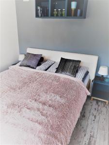 Posteľ alebo postele v izbe v ubytovaní Apartament przy Źródełku