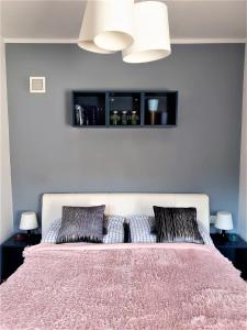 Posteľ alebo postele v izbe v ubytovaní Apartament przy Źródełku