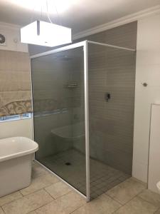 Vannituba majutusasutuses The Orchards Residence