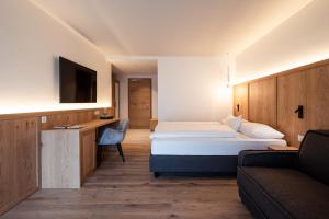 A bed or beds in a room at B&B Boutiquehotel Clara