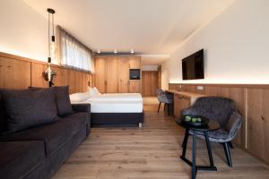 A bed or beds in a room at B&B Boutiquehotel Clara