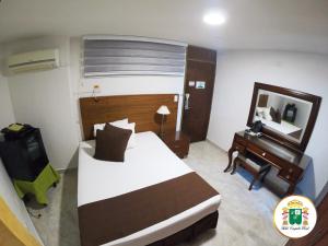 Hotel Caquetá Real HSC客房内的一张或多张床位