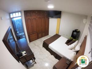 Hotel Caquetá Real HSC客房内的一张或多张床位