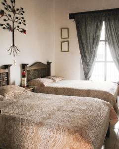 Krevet ili kreveti u jedinici u objektu El Naranjo Hotel Finca Urbana