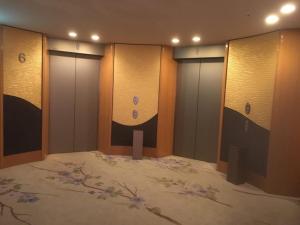 a room with three elevators with purple flowers on it at Hotel Grand Vert Gizan - Vacation STAY 95368 in Gifu