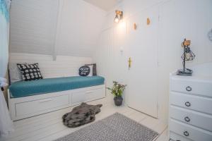 a dog laying on the floor in a small room at KalandFészek in Orfű +27 photos