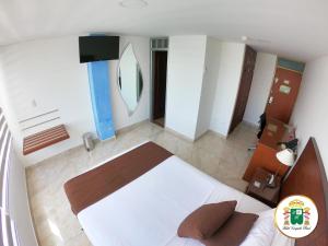 Hotel Caquetá Real HSC客房内的一张或多张床位