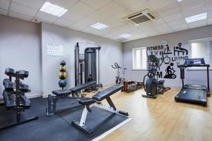 a gym with cardio equipment in a room at Holiday Inn Belfast by IHG in Belfast