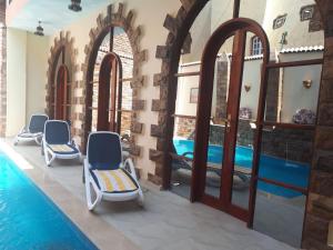 Bazén v ubytování Pyramids Luxor Hotel & SPA nebo v jeho okolí