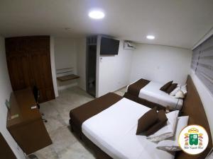 Hotel Caquetá Real HSC客房内的一张或多张床位