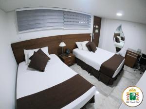 Hotel Caquetá Real HSC客房内的一张或多张床位