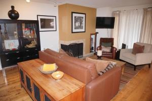 a living room with a couch and a table at 100 Dean St E #2B in Aspen