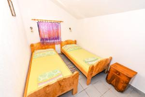 Postel nebo postele na pokoji v ubytování Apartments Goldie