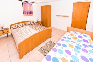 Postel nebo postele na pokoji v ubytování Apartments Goldie