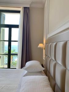 Postel nebo postele na pokoji v ubytování Thermae Sylla Spa & Wellness Hotel