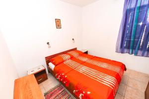 Postel nebo postele na pokoji v ubytování Apartments Goldie