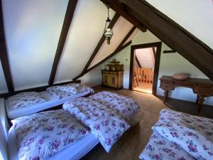 a bedroom with two beds in a attic at CHALUPA V PANSKÝM , Staré Křečany u Rumburku in Panský