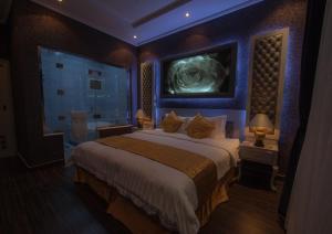 Ліжко або ліжка в номері Taleen AlSahafa Hotel Apartments
