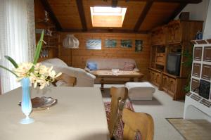 a living room with a couch and a table at Landhaus St. Rupert in Bad Hofgastein