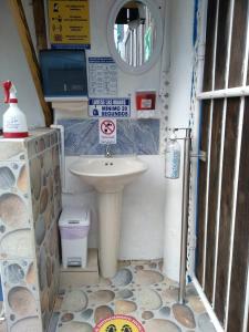 
a bathroom with a sink and a toilet at Posada San Nicolas in San Andrés
