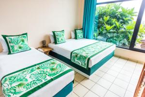 Krevet ili kreveti u jedinici u objektu Tahiti Airport Motel